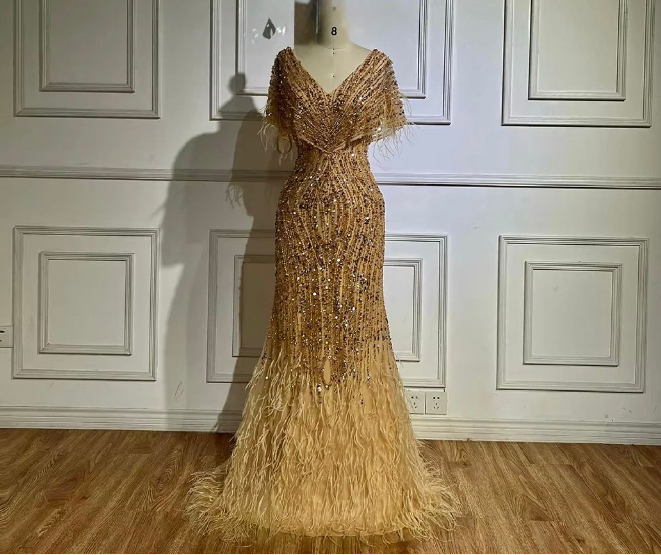 Golden Beaded Mermaid Evening Gown with Feather Detail