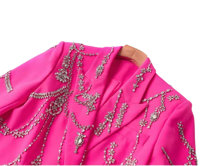 A tailored blazer dress embellished with sparkling rhinestones