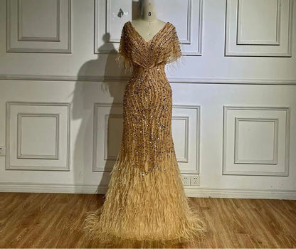 Golden Beaded Mermaid Evening Gown with Feather Detail