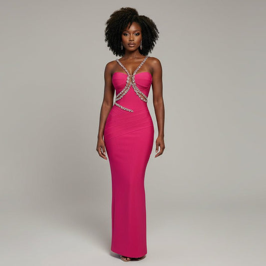 Pink dress with a decorative back on a mannequin against a metallic background